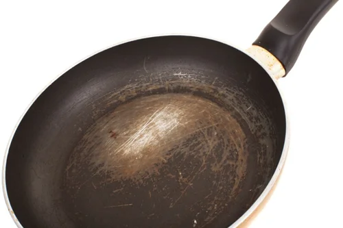 https://www.kitchenunder100.com/wp-content/uploads/2021/09/Dump-Your-Non-Stick-Pan-When-Its-Scratched.webp